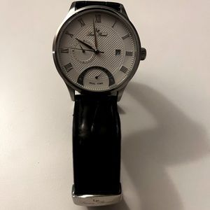 White minimalistic design Lucien Piccard with black band.